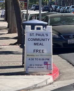 Sidewalk sign advertising St. Paul's Community Meal