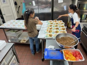 Volunteers preparing Community Meal